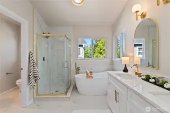 Enjoy the beautifully renovated primary bathroom, designed with spa-like features for optimal relaxation.