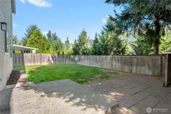 The backyard offers ample space to establish a garden, providing an opportunity to create a personalized outdoor retreat.