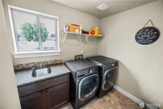 Laundry room conveniently located upstairs