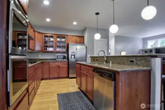 Stainless appliances, double oven, gas stove, granite countertops.