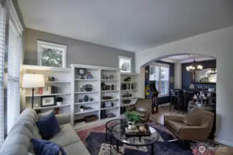 Formal living room with built-in shelving.
