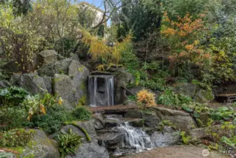 The megalithic granite water feature creates a bucolic setting, creating a private pocket of unexpected natural beauty within easy reach of and all things Seattle