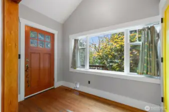 Expansive entry foyer allows for lovely North light with closet &storage upon entry.