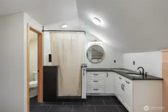 Primary Suite, Recently remodeled with contemporary shower and lush green serpentine counters