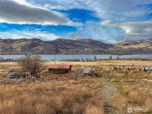 Previous homesite location (mobile home removed) with outbuildings on NW corner.