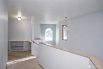 Upper-level landing offering a built-in workspace.