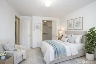 Upper-level first guest suite with generous walk-in closet.