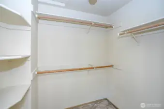 Generous walk-in closet for the first guest suite.