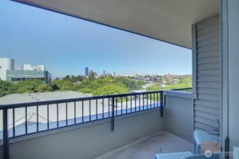 A private covered deck that faces the city and Puget Sound.