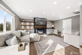 Thoughtfully designed details extend throughout this entire home- custom built-ins with black walnut shelving & an eye catching gas fireplace centerpiece.