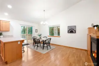 Roomy dining area adjacent to the kitchen with easy access to the back deck, perfect for grilling, entertaining and indoor/outdoor living.