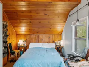 Cozy pine ceiling and walls give you that cozy cabin vibe while being in the heart of Seattle!