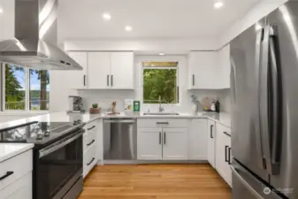 Updated and ready for the chef in your life, the gorgeous suite of stainless appliances all stay with the home, and the classic shaker style cabinets with updated matte black hardware will be serving style for years to come.