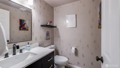 A thoughtfully placed downstairs half bath, designed for ease and accessibility