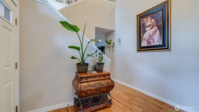 Step into these gleaming hardwood floors that flow seamlessly through an open-concept layout, with direct access to the upstairs retreat!