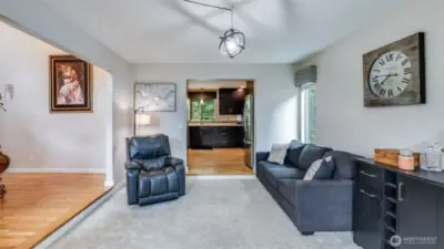 This inviting sitting area is conveniently located just off the entrance, perfect for welcoming guests or relaxing with ease