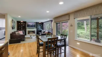 Large windows fill the room with abundant natural light, creating a bright and welcoming atmosphere throughout the day