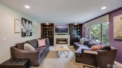 Cozy seating arrangement designed for conversation and comfort, anchored by soft textiles and tasteful accents!