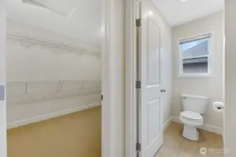Primary en-suite with large walk-in closet.