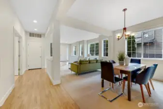 Formal dining room, formal living, and den/5th bedroom to the left on main floor.