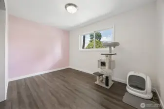 First bedroom with a fun accent wall.