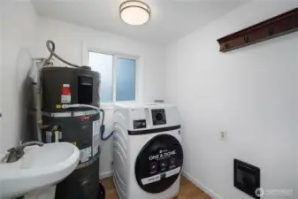 Laundry room - newer water heater and new washer and dryer