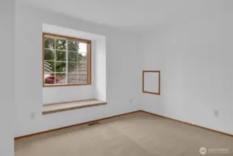 Secondary bedroom with window seat with storage inside