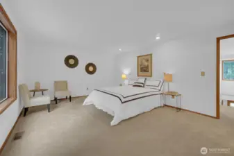 Spacious primary bedroom with sitting area. Plenty of room for all your furniture