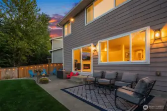 The living room steps out onto this spacious patio through the extra large sliding glass doors pictured here.