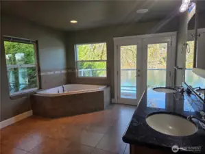 Main suite jetted tub & private balcony.