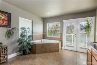 Jetted tub & french doors off main suite up.