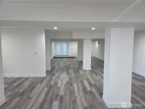 A ton of lower level living has separate entry to beach access & entry to detached garage.