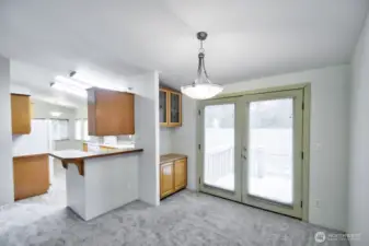 View of dining area with built in cabinets and breakfast bar