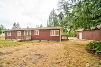 Back view from the property line of home and shop