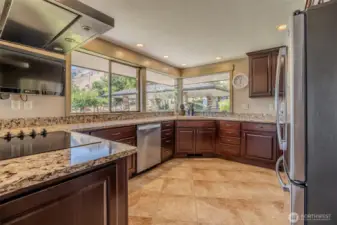 Kitchen with expansive counter space and large windows