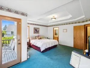 Primary Bedroom with elegant recessed ceilings.