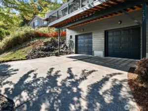 A close-up of the garage shows the extra wide proportions of the two door, two car garage design.