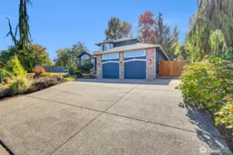 Large driveway with 3 car tandem garage + RV parking.