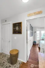 Lower level includes: bedroom + full bathroom + laundry area and garage access.