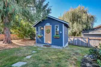 Cute backyard shed adds both character and function.