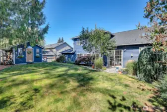 Expansive backyard with room to relax + play + garden.