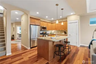 Wow! This is an amazing kitchen, complete with double oven, granite slab countertops, pantry, and eat-in space.