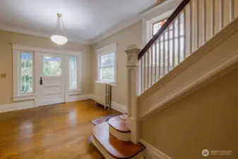 Gorgeous wood floors, and wood stairwell.