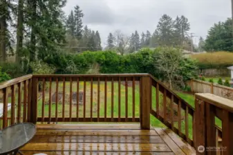 Beautiful deck to the studio with exterior entryway, offering a nice space to sit and enjoy the view.