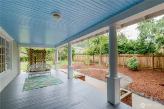 Wrap-around porch with fresh coat of paint, sliding fence and access to the large, fenced yard.