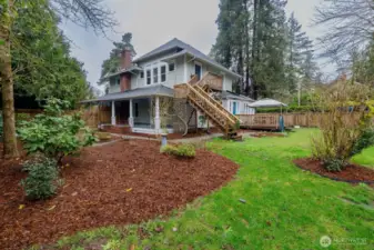Large deck in the backyard with cover, stairs to the exterior entry for the studio, and with a seating area atop.  Detached shed for storage of your garden implements.