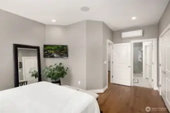 Two oversized closets feature custom built-in storage, providing ample space and organization for all your wardrobe needs.