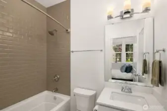A full en-suite bath complements the bedroom, delivering both comfort and privacy.