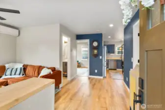 Seamless flow between kitchen, living, and dining.