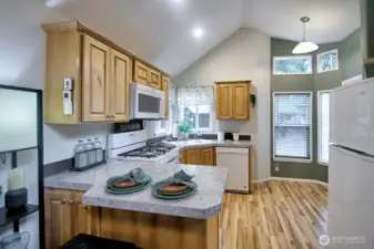 KITCHEN WITH BAR AND 2 STOOLS
